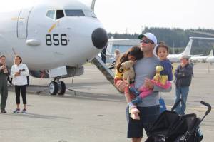 Photo by Karina Andrew/Whidbey News-Times
A family watches a Navy Search and Rescue demonstration during an open house at Naval Air Station Whidbey Island Sept. 17. T