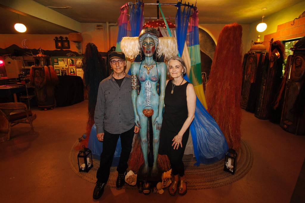 Photo by David Welton
Jerry Wennstrom and Marilyn Strong with Water, one of Wennstroms sculptures representing the four elements.