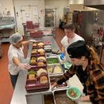 Photo courtesy of jail At right, Clare Brown, supervising cook in the Island County Jail, prepares meals for inmates Monday night. The county contracts with food vendor Summit for the facility.