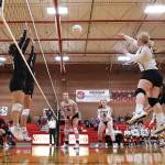 Photo by John Fisken
Volleyballers take to the air in the Oct. 15 match between Coupeville and Neah Bay.