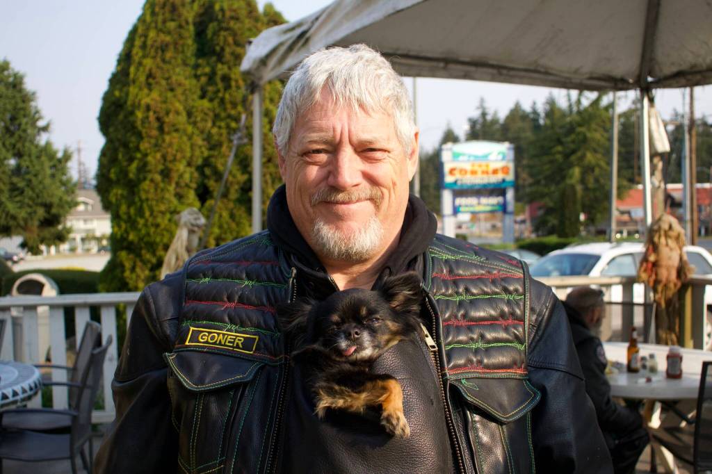 Dwayne Goner Fletcher always carries his dog Gizmo in a specialty-made pouch in his jacket. Gizmo also has a tiny helmet and sunglasses.