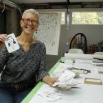 Photo by Kira Erickson/South Whidbey Record
Langley artist Meredith MacLeod displays cards printed with her portraits and writing prompts.