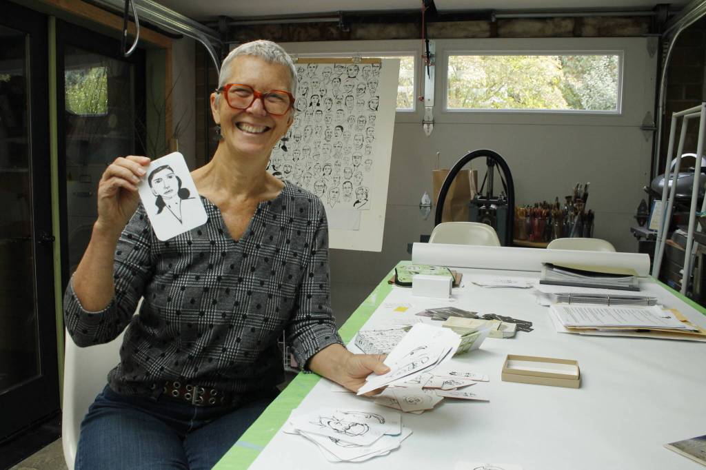 Photo by Kira Erickson/South Whidbey Record
Langley artist Meredith MacLeod displays cards printed with her portraits and writing prompts.