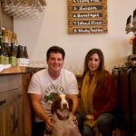 Photo by Rachel Rosen/Whidbey News-Times
Jeff Stoner, Kim Taylor and their dog Tate. Greenbank Ciderys taproom allows friendly dogs.