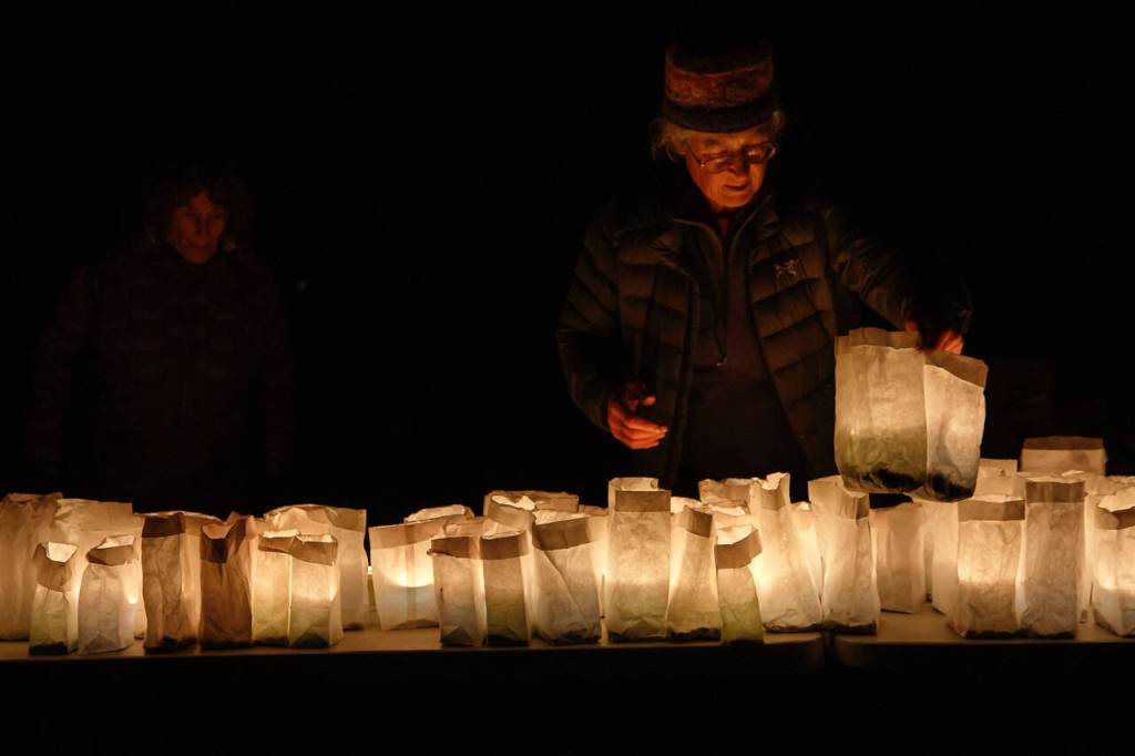 Photo by David Welton
Carey Peterson placed luminaries at the Langley Woodman Cemetery, something that is done every year to celebrate All Souls Eve.