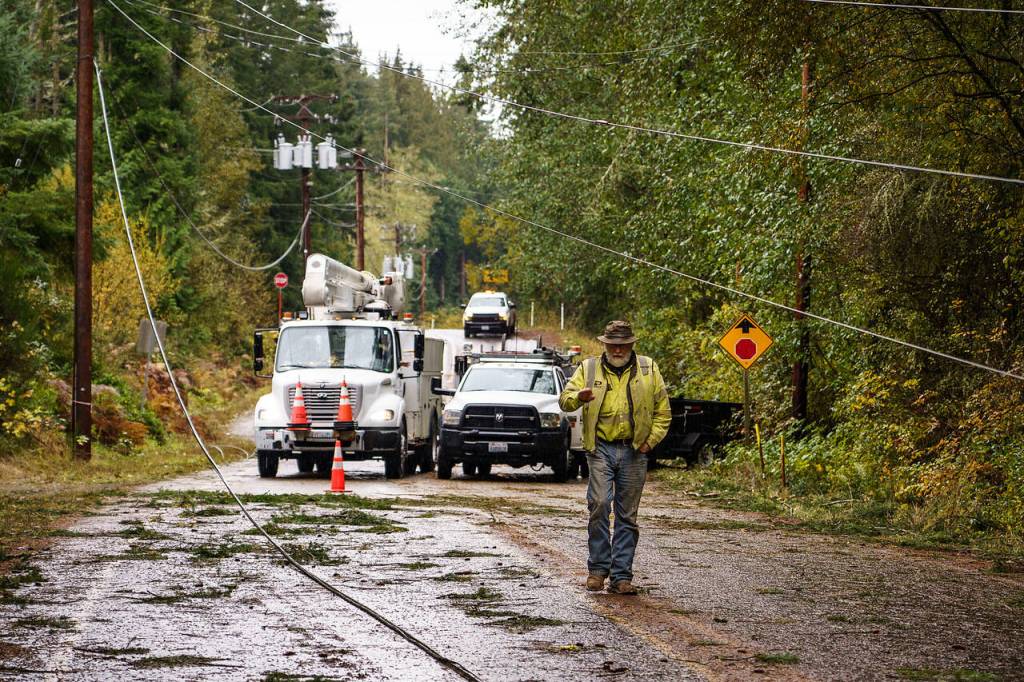 Photo by David Welton
Repair crews work to restore power to Whidbey Island after aggressive winds took out power lines and poles over the weekend.