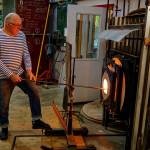 Photos by David Welton
John de Wit readies a piece of glass in the furnace.