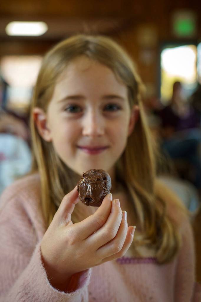 Photo by David Welton
Ciara Boyd holds up a chocolate thumbprint cookie made with Nutella, a variation of the classic vanilla thumbprint cookie with jam.