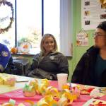 Photo by Rachel Rosen/Whidbey News-Times
From left, Marquise Moses, Lacey Lutz and Trey McIntire share a conversation over the Friendsgiving meal.