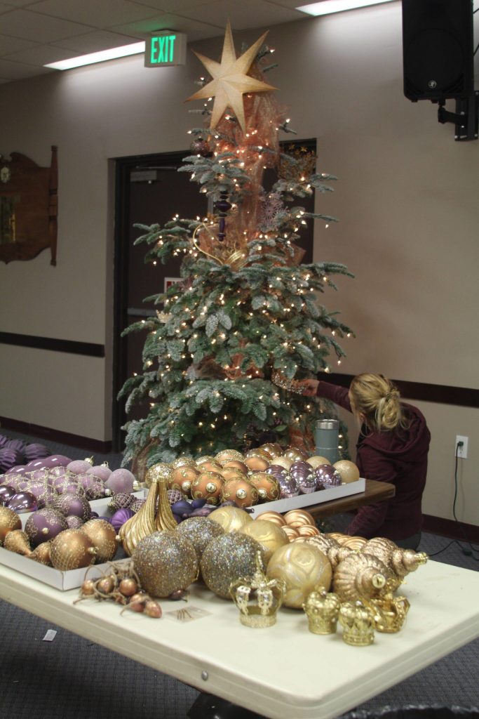 Photos by Karina Andrew/Whidbey News-Times
Karlyne Larsen decorates a tree for the Festival of Trees auction at the Elks Lodge.