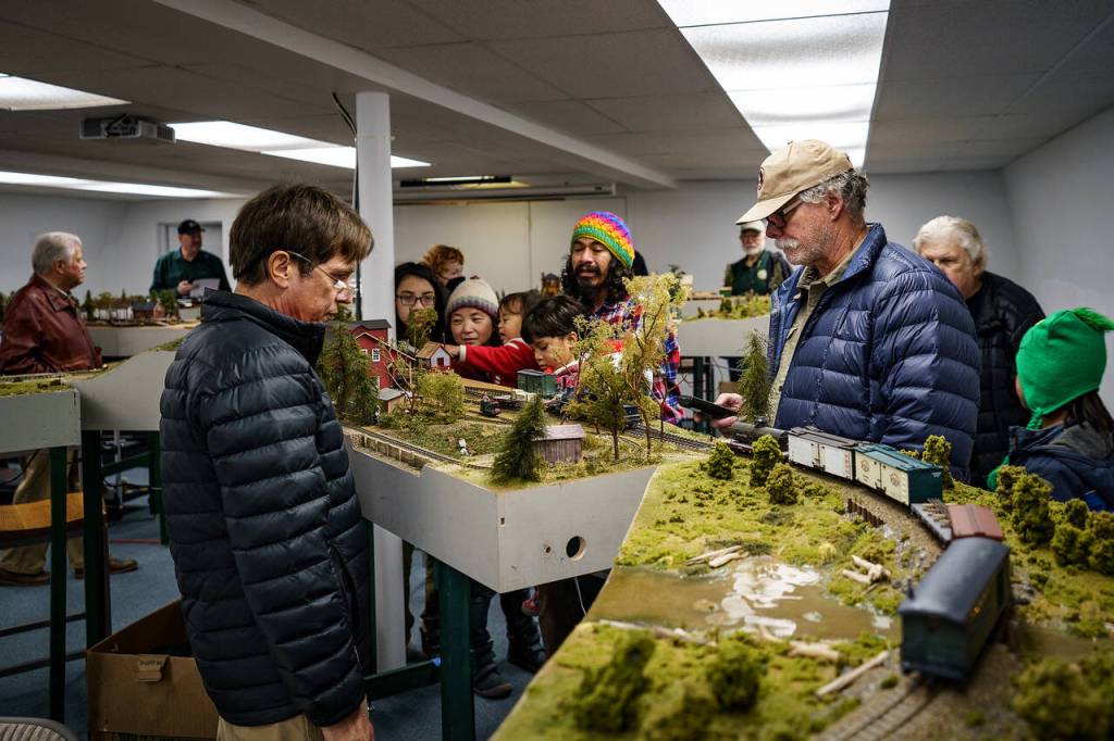Photo by David Welton
People of all ages flocked to the train show on its opening day. The cars move between handmade modules, which depict historical scenes.