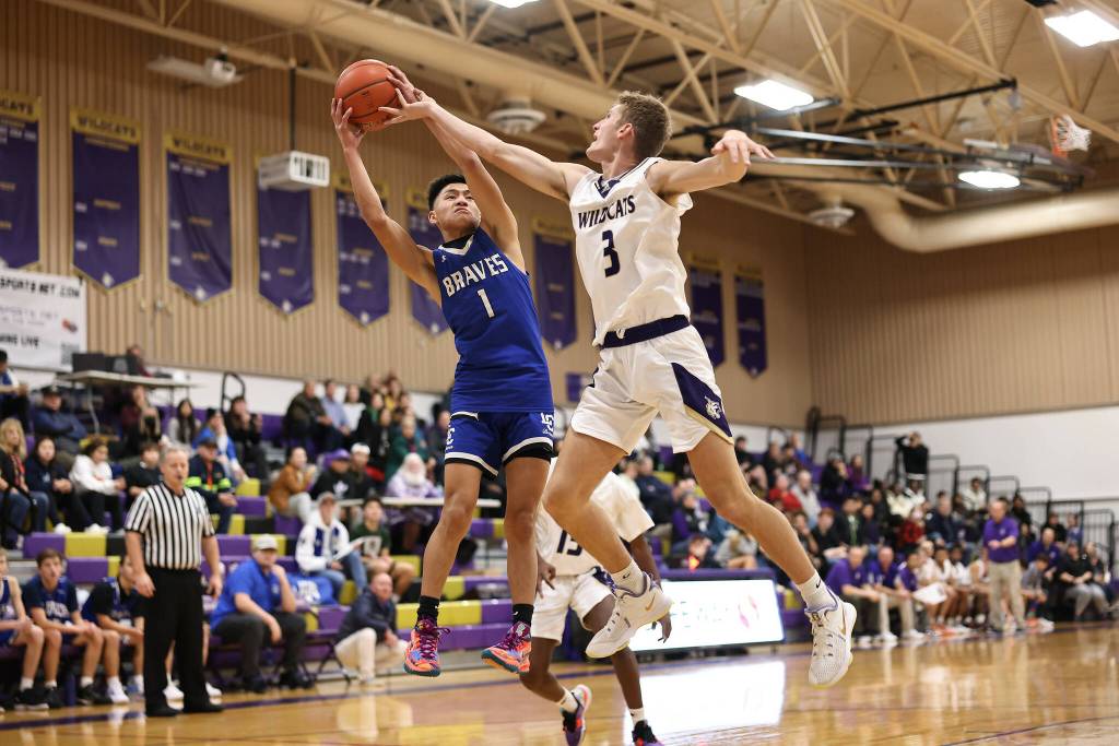 Photo by John Fisken
Oak Harbor athlete Taylen Bader attempts to steal the ball at a Dec. 2 game agaisnt La Conner. Oak Harbor defeated La Conner 73-44 in the first game of the season.