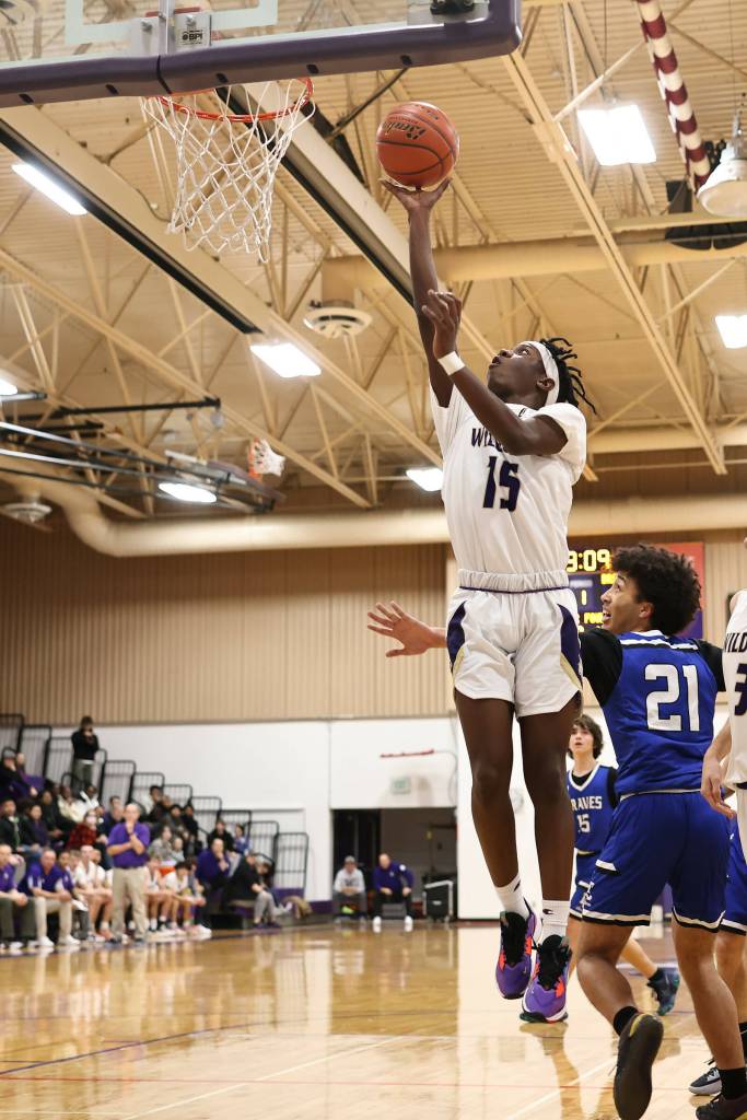 Photo by John Fisken
Oak Harbor athelte Shane Warden shoots the ball at a Dec. 2 game agaisnt La Conner. Oak Harbor defeated La Conner 73-44 in the first game of the season.