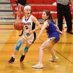 Photo by John Fisken
Coupeville High School Senior Gwen Gustafson tries to break past a Crescent defender during a basketball game Wednesday night. The girls team beat visiting Crescent 46-22.