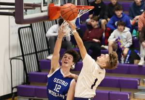 Photo by John Fisken
Oak Harbor athlete Brock Boyer makes a layup at a Dec. 17 game against Sedro-Woolley. The Oak Harbor boys varsity team narrowly lost 62-59 in overtime. The team is 2-4 this season.