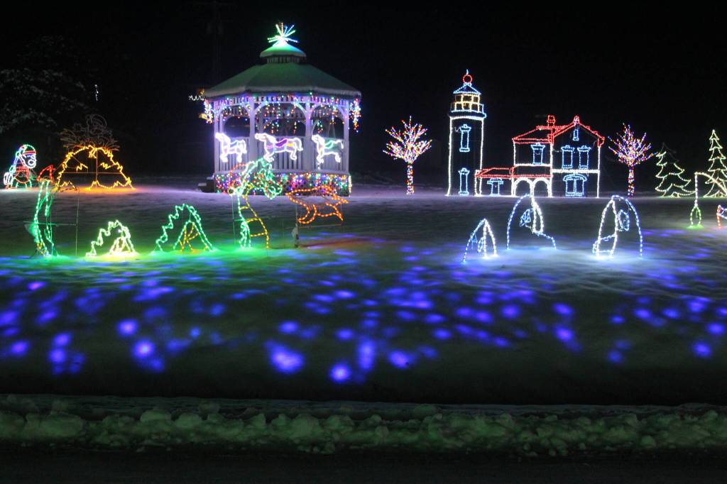 An extravagant light display at the corner of Hastie Lake Road and West Beach Road features a variety of characters, from Christmas classics like Santa Claus, reindeer and gingerbread people to less conventional holiday friends like dinosaurs, sea monsters and orcas. (Photo by Karina Andrew/Whidbey News-Times)