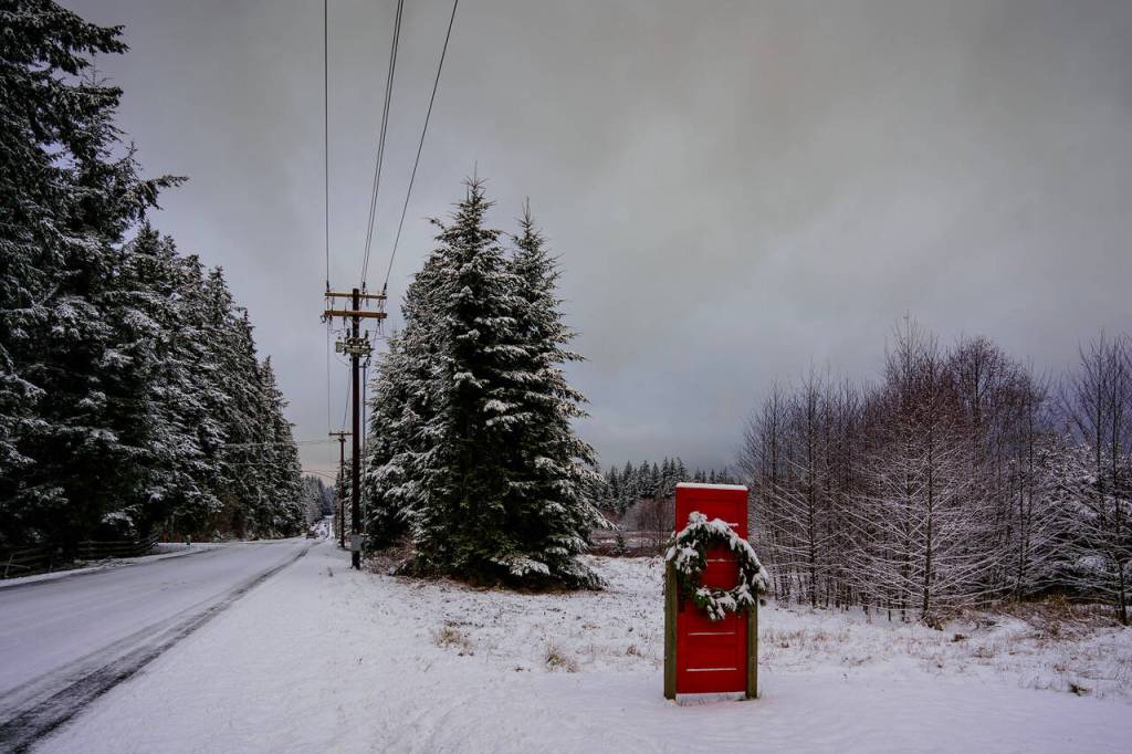 Photo by David Welton
The famous Red Door stands in the snow on Cultus Bay Road.