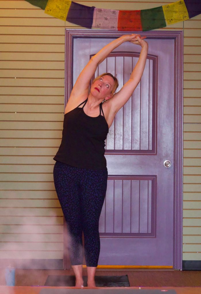 Photo by Rachel Rosen/Whidbey News-Times
Suzann Vincent stretches her arms overhead during yoga class at Chrysalis Yoga Shala.