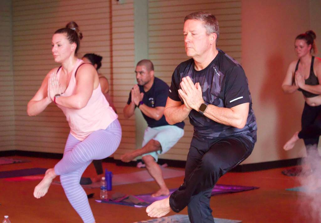 Photo by Rachel Rosen/Whidbey News-Times
From left, Katrina Riippa, Juan Rosas, Ed OKeefe and Jensen Sohns stand in chair pose during a Friday morning class.
