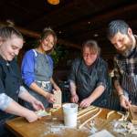 From left, Amy Wise, Courtney Storer, Alison Wiefels and Captain Whidbey head chef Sean Prater make homemade pasta. (Photo by David Welton)