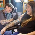 Photo by Rachel Rosen/Whidbey News-Times
Molly Vigallon tattoos Molly Waterbury in Nite Owls new location. Vigallon has been working at Nite Owl for eight years.