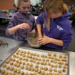Photo by David Welton
Fifth graders Brooklyn Simmons, left, and Sadie Rich shape the dough for cookies made during South Whidbey Elementary Schools MLK Day of Service.
