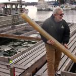 Harbor Master Chris Sublet sets up tubing.