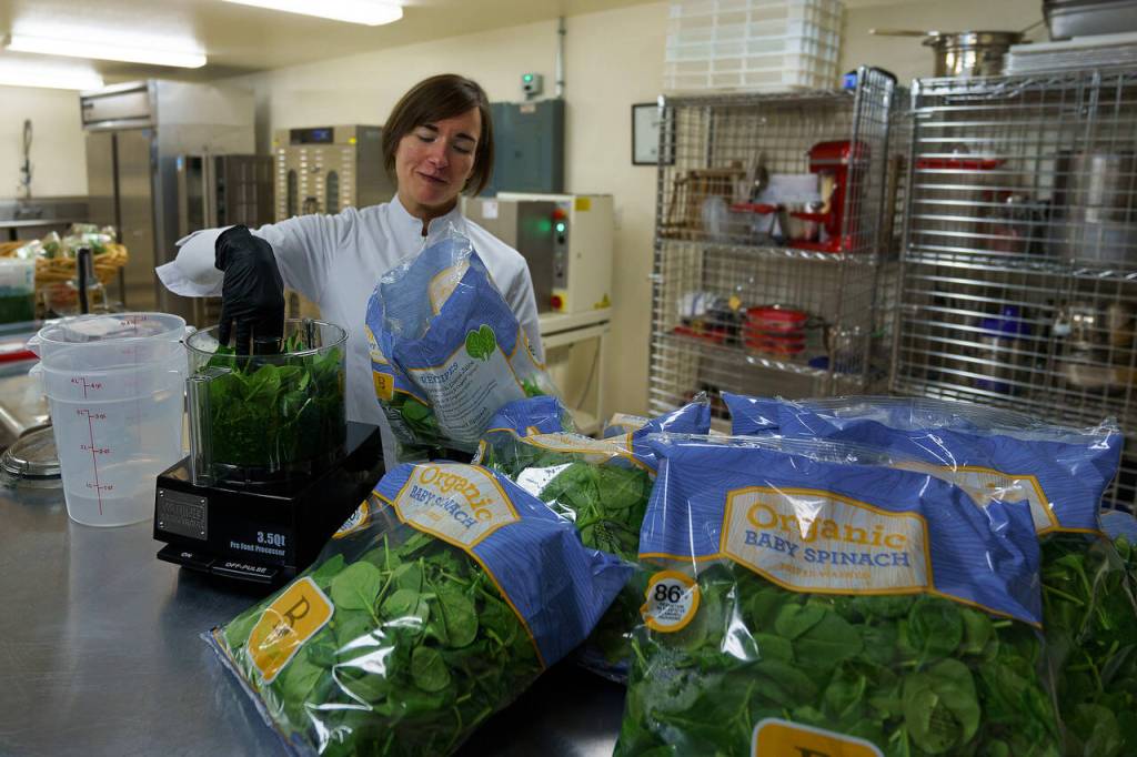 Photos by David Welton
For around every 17 pounds of flour she uses in her dough, Aurora Echo adds 5 pounds of fresh baby spinach.