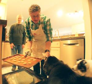 Photo by Karina Andrew/Whidbey News-Times
Arjai Allred puts some homemade dog treats in the oven to bake.