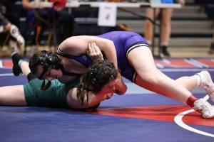 Photo by John Fisken
Zoe Beeman pins an opponent at the sub-regional tournament Feb. 3. Beeman placed second in her weight class and qualified for the regional tournament Saturday.