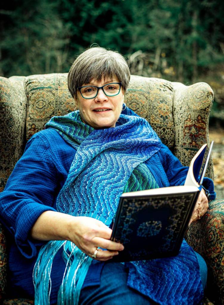 Photo by Dennis Browne
Danette Sulgrove models the storycloth, a 72-inch-long art piece with loose, unfinished ends.