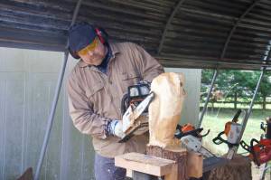 Photo by Rachel Rosen
Ted Boesch carves an owl sculpture.
