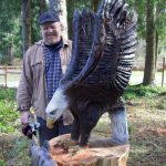 Photo by Rachel Rosen
Ted Boesch makes chainsaw carvings of different animals, such as this eagle that he keeps in his front yard.