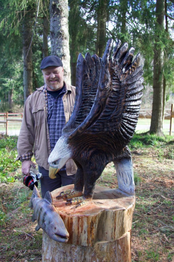 Photo by Rachel Rosen
Ted Boesch makes chainsaw carvings of different animals, such as this eagle that he keeps in his front yard.