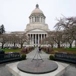 The sun dial near the Legislative Building is shown under cloudy skies, March 10, 2022, at the state Capitol in Olympia. (AP Photo/Ted S. Warren)