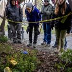 Mystery Weekend participants peered at the scene of the crime, which was located at Langley Park this year.