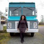Willow Mietus, 50, poses for a photo at her home in Coupeville, Washington on Wednesday, Feb. 1, 2023. Mietus bought a former Frito-Lay truck to sell her dyed yarn out of. She calls it "The Wool Wagon." (Annie Barker / The Herald)