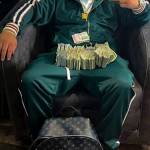 Courtesy of FBI
Federal agents obtained a selfie photo of Bryce Hill with piles of cash through a search warrant of his phone.