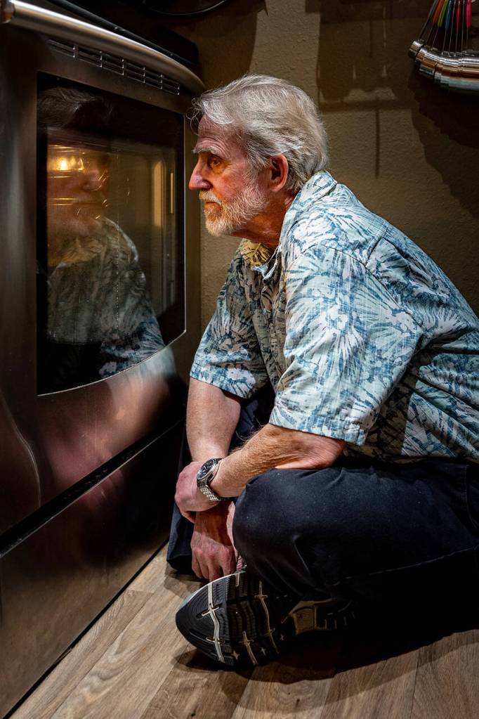Photo by David Welton
Louie Rochon sits on bread watch before the oven, keeping a close eye on his focaccia bread to avoid burning.