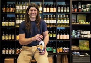 Photo by David Welton
Jeremy Kyncl of Hierophant Meadery holds an award-winning bottle of Butterbee, a popular butterscotch-flavored mead produced in Freeland. Kyncl is the speaker at two upcoming library talks, which center on bees, honey and the brews he makes.