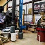 Two large industrial coffee roasters sit in one of two roastery buildings at Mukilteo Coffee Roasters on Oct. 10, 2018 in Langley, Washington. (Olivia Vanni / The Herald)