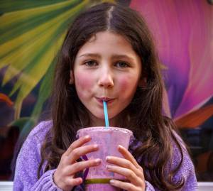 Photo by David Welton
Willow Skaggs, 7, enjoys a drink from TONIC Juice & Remedy, a new business in downtown Langley.