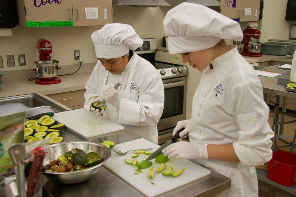 Alex Wutzke slices avocados for avocado fries with sriracha mayo, the competitions winning dish. (Photo by Rachel Rosen/Whidbey News-Times)