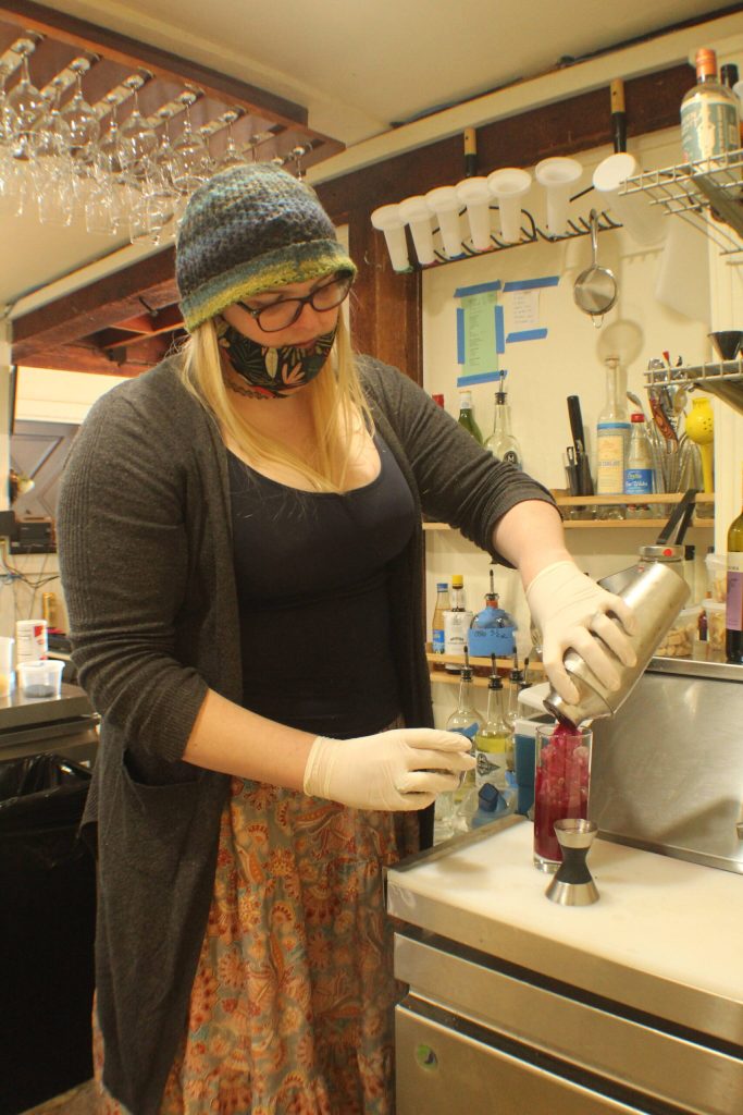 Photo by Karina Andrew/Whidbey News-Times
Rose Worley makes one of her signature cocktails at Overboard, the new restaurant she owns with her spouse, Lees Datin.
