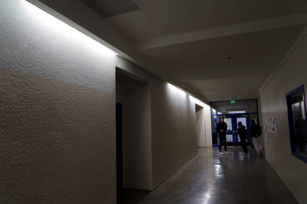 The second floor corridors of the high school/middle school are dimly and sparsely lit. (Photo by David Welton)