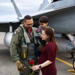 Sarah Heller greets her husband Robert with their son Saturday afternoon.