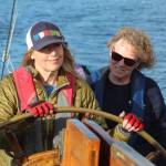 Francesca Russo, left, and Martha Ford steer the Suva during a crew training sail Monday evening. (Photo by Karina Andrew/Whidbey News-Times)