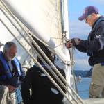 Volunteer crew members practice their various duties during a training sail on the Suva April 24. (Photo by Karina Andrew/Whidbey News-Times)