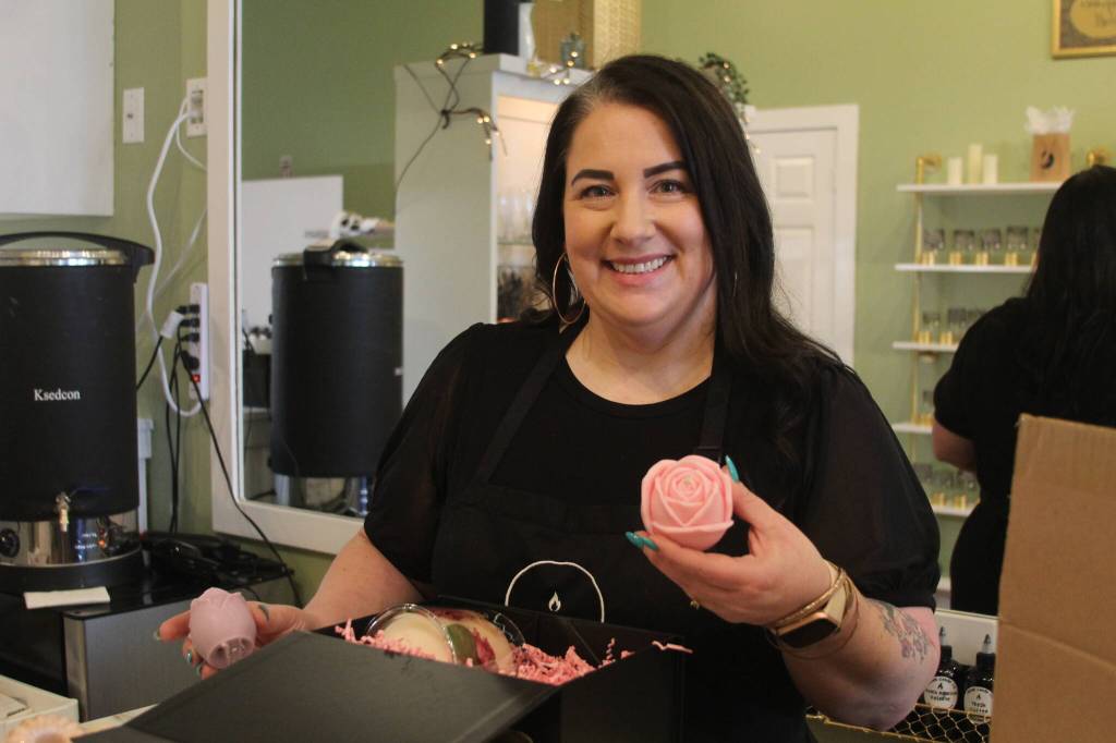 Photo by Karina Andrew/Whidbey News-Times
Megan Varner-Duckett packs a gift box with her homemade candles.