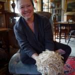 Nan Leaman shows off a Teeswater fleece. (Photo by David Welton)